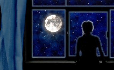 Woman in shadow standing at a window, reflectively gazing at the moon. 