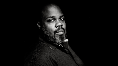 A black and white portrait of counter-tenor, Reginald Mobley.