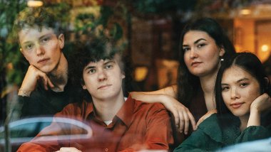 The Maple Quartet—Gabriel Hennebury (violoncello), John Crowley (viola), and violinists Magali Pelletey and Isabel Chen—seen through the window of Java's Café near the Eastman School of Music in Rochester, New York.