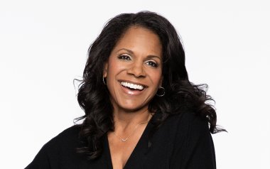 Portrait of Audra McDonald in front of a white backdrop 