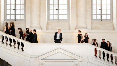 Musicians posing on a staircase