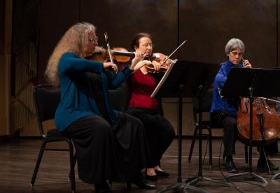 Earplay members: T. Baune, E. Rose, T. Moore performing as a string trio.