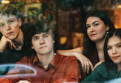 The Maple Quartet—Gabriel Hennebury (violoncello), John Crowley (viola), and violinists Magali Pelletey and Isabel Chen—seen through the window of Java's Café near the Eastman School of Music in Rochester, New York.