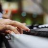 Fingers on piano